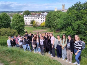 Foreground: students with teacher; Background: Canterbury